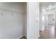 Walk-in closet with built-in shelving and a glimpse of the hallway at 4730 E Craig Rd # 1115, Las Vegas, NV 89115