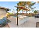 Backyard bar area featuring an outdoor grill, seating, and view of the pool and patio at 4764 Lana Dr, Las Vegas, NV 89121