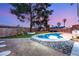 This backyard boasts a sparkling pool, fun playground, and meticulous landscaping at 4764 Lana Dr, Las Vegas, NV 89121