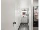 Modern hallway bathroom with a glass shower door and sleek marble tile at 4764 Lana Dr, Las Vegas, NV 89121
