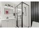 Modern bathroom featuring white cabinets and a glass shower with black trim at 4764 Lana Dr, Las Vegas, NV 89121