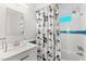 Stylish bathroom featuring tile surround, showerhead, vanity, and shower curtain at 4764 Lana Dr, Las Vegas, NV 89121
