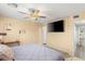 Bright bedroom with hardwood floors, ceiling fan, and flat screen tv at 4764 Lana Dr, Las Vegas, NV 89121