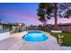 Backyard showcasing a kidney-shaped pool with ample patio space and lush artificial grass at 4764 Lana Dr, Las Vegas, NV 89121