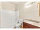 Bathroom with granite countertops, tiled floors, and a shower-tub combo at 4830 Grey Wolf Ln # 104, Las Vegas, NV 89149