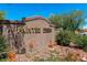 Painted Desert community entrance featuring rock landscaping and desert plants at 4830 Grey Wolf Ln # 104, Las Vegas, NV 89149