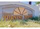 Community entrance sign 'Turning Point' amidst greenery at 4830 Grey Wolf Ln # 104, Las Vegas, NV 89149