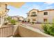 Townhome boasts balcony, desert landscaping and beige stucco at 4830 Grey Wolf Ln # 104, Las Vegas, NV 89149