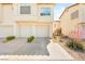 Charming townhome featuring a private attached garage and convenient driveway at 4830 Grey Wolf Ln # 104, Las Vegas, NV 89149