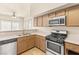 Modern kitchen features a stainless steel dishwasher and gas range at 4830 Grey Wolf Ln # 104, Las Vegas, NV 89149