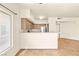 Kitchen with stainless steel appliances, breakfast bar, and well-lit cabinets at 4830 Grey Wolf Ln # 104, Las Vegas, NV 89149