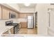 Functional kitchen area boasts stainless steel appliances, pantry and plenty of counter space at 4830 Grey Wolf Ln # 104, Las Vegas, NV 89149