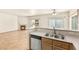 Kitchen area view showcases a gas fireplace and stainless steel appliances at 4830 Grey Wolf Ln # 104, Las Vegas, NV 89149