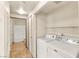 Laundry room with a washer, dryer and tiled flooring at 4830 Grey Wolf Ln # 104, Las Vegas, NV 89149
