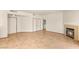 Spacious living room with tile flooring, fireplace, and access to laundry room at 4830 Grey Wolf Ln # 104, Las Vegas, NV 89149
