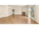 Spacious living room with tile flooring, fireplace, sliding door access to patio at 4830 Grey Wolf Ln # 104, Las Vegas, NV 89149