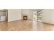 Spacious living room with tile flooring, fireplace, and sliding glass doors to patio at 4830 Grey Wolf Ln # 104, Las Vegas, NV 89149