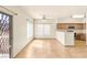 Bright living room with tile floors, fan, natural light, and a view of the kitchen at 4830 Grey Wolf Ln # 104, Las Vegas, NV 89149