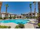 Inviting community pool with clear water, surrounded by lounge chairs and lush landscaping, perfect for relaxation at 4830 Grey Wolf Ln # 104, Las Vegas, NV 89149