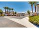 Residential street view of Paradise Point neighborhood with palm trees and well-maintained landscaping at 4830 Grey Wolf Ln # 104, Las Vegas, NV 89149
