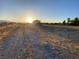 Expansive backyard with a charming home, promising ample space for outdoor enjoyment and future development at 4910 Elizabeth St, Pahrump, NV 89048
