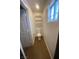 Small bathroom featuring a toilet, shelving, and a window at 4910 Elizabeth St, Pahrump, NV 89048