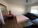 Bedroom featuring wood floors and a bed at 4910 Elizabeth St, Pahrump, NV 89048