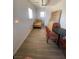 This is a bedroom area with tile flooring and a small table and chairs at 4910 Elizabeth St, Pahrump, NV 89048