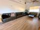 Inviting living room with wood-style flooring and comfortable couches, ideal for entertaining guests and Gathering at 4910 Elizabeth St, Pahrump, NV 89048