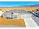 Aerial view of modern home with meticulous desert landscaping at 5400 E Grain Mill Rd, Pahrump, NV 89061