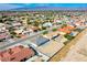 Expansive aerial view showcasing a well-planned residential neighborhood with mountain views in the distance at 5400 E Grain Mill Rd, Pahrump, NV 89061