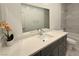 Stylish bathroom with a large mirror, spacious vanity and a tub-shower combo at 5400 E Grain Mill Rd, Pahrump, NV 89061
