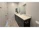 Bathroom with a single vanity, white quartz countertop and a large mirror at 5400 E Grain Mill Rd, Pahrump, NV 89061