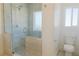 Bathroom featuring a glass shower with seat and a modern toilet at 5400 E Grain Mill Rd, Pahrump, NV 89061