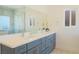 Bathroom with double vanity, quartz countertop, large mirror, and glass shower at 5400 E Grain Mill Rd, Pahrump, NV 89061