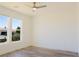 Bedroom with views of the yard, featuring wood-look floors at 5400 E Grain Mill Rd, Pahrump, NV 89061