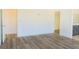 Bedroom with wood floors, two doorways and an ensuite bathroom at 5400 E Grain Mill Rd, Pahrump, NV 89061