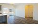 Bright dining area with wood-look floors and a sliding glass door at 5400 E Grain Mill Rd, Pahrump, NV 89061