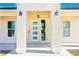 Beautifully designed front entrance with decorative sidelights and architectural columns at 5400 E Grain Mill Rd, Pahrump, NV 89061