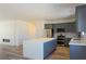 Open concept kitchen with a large island and modern appliances at 5400 E Grain Mill Rd, Pahrump, NV 89061