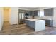 Modern kitchen features gray cabinets, stainless steel appliances, and a large kitchen island at 5400 E Grain Mill Rd, Pahrump, NV 89061