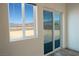 Bright room features a sliding glass door, a large window, and mountain views at 5400 E Grain Mill Rd, Pahrump, NV 89061