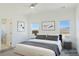 Bright main bedroom with mountain views, a ceiling fan and ensuite bathroom at 5400 E Grain Mill Rd, Pahrump, NV 89061