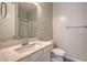 Stylish bathroom featuring a vanity with a mirror and glass-enclosed shower at 5429 Blinding Lights St, North Las Vegas, NV 89081