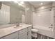 Bright bathroom featuring a tub and shower combo and a white vanity at 5429 Blinding Lights St, North Las Vegas, NV 89081