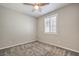 Comfortable bedroom featuring carpet flooring, a ceiling fan, and a window at 5429 Blinding Lights St, North Las Vegas, NV 89081