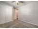 The bedroom features carpet flooring, a ceiling fan, and sliding door closet at 5429 Blinding Lights St, North Las Vegas, NV 89081