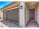 Close up of a home's exterior, including the garage, brick paved driveway, and front door at 5429 Blinding Lights St, North Las Vegas, NV 89081