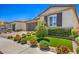 Beautiful single-story home with a meticulously landscaped front yard and synthetic grass at 5429 Blinding Lights St, North Las Vegas, NV 89081