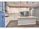 Bright kitchen with island, stainless appliances, pendant lighting and mosaic tile backsplash at 5429 Blinding Lights St, North Las Vegas, NV 89081